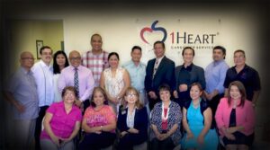 A group photo of the 1Heart Las Vegas Grand Opening and Ribbon Cutting Ceremony