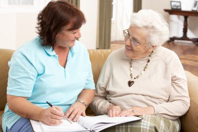 Woman reviewing home service paperwork