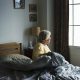 senior woman sitting up in bed