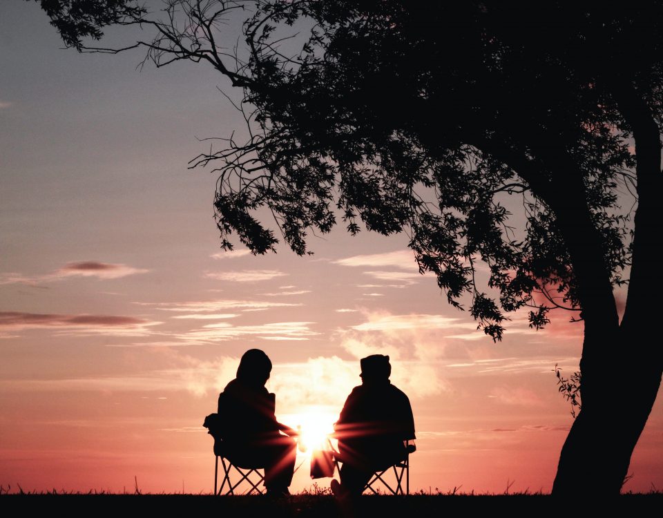Two people enjoying the sunset