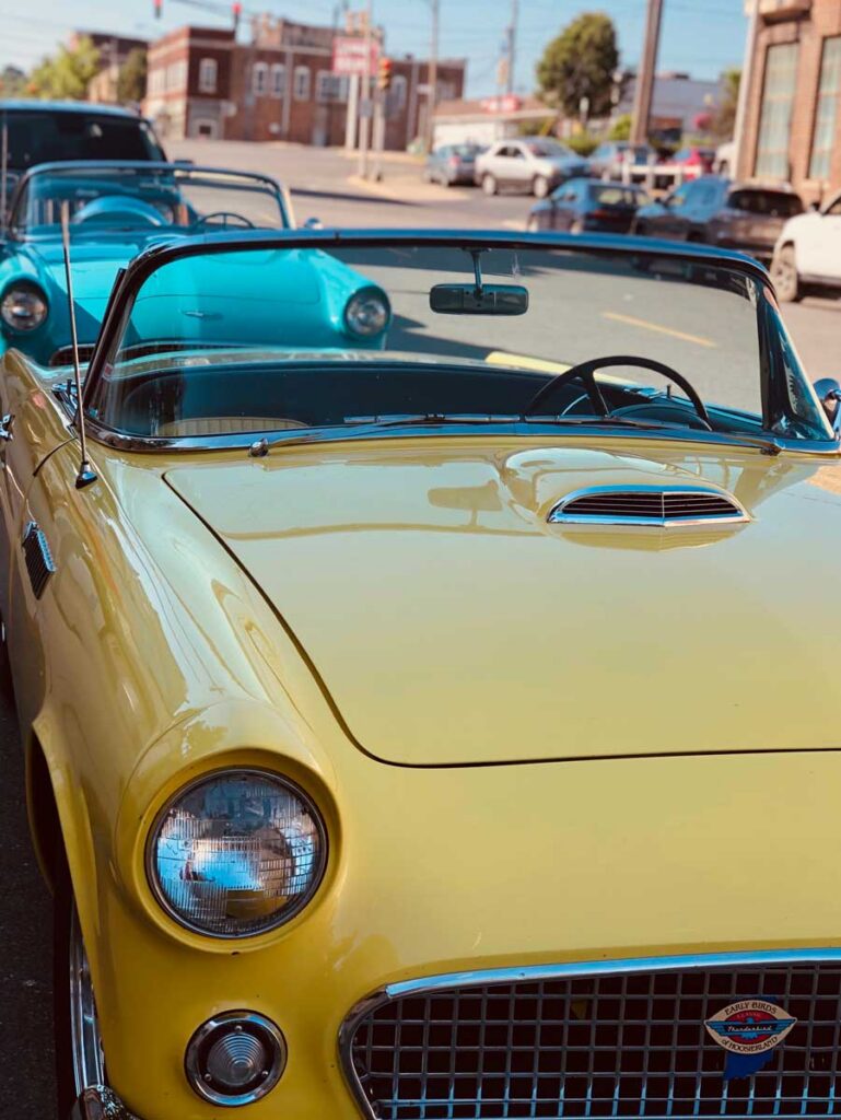 vintage cars parked on town street