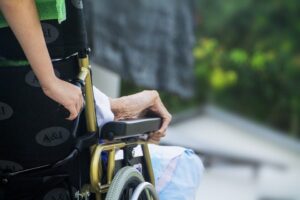 caregiver providing care to elderly patient