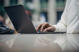 senior using laptop computer