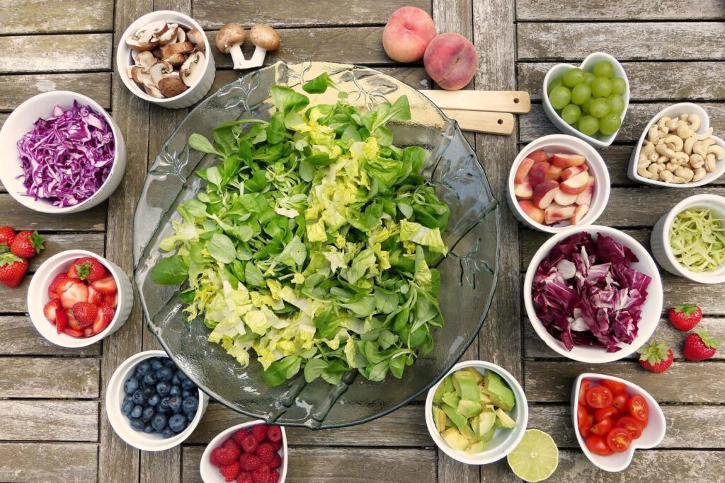 Various fruits and vegetables set on a table