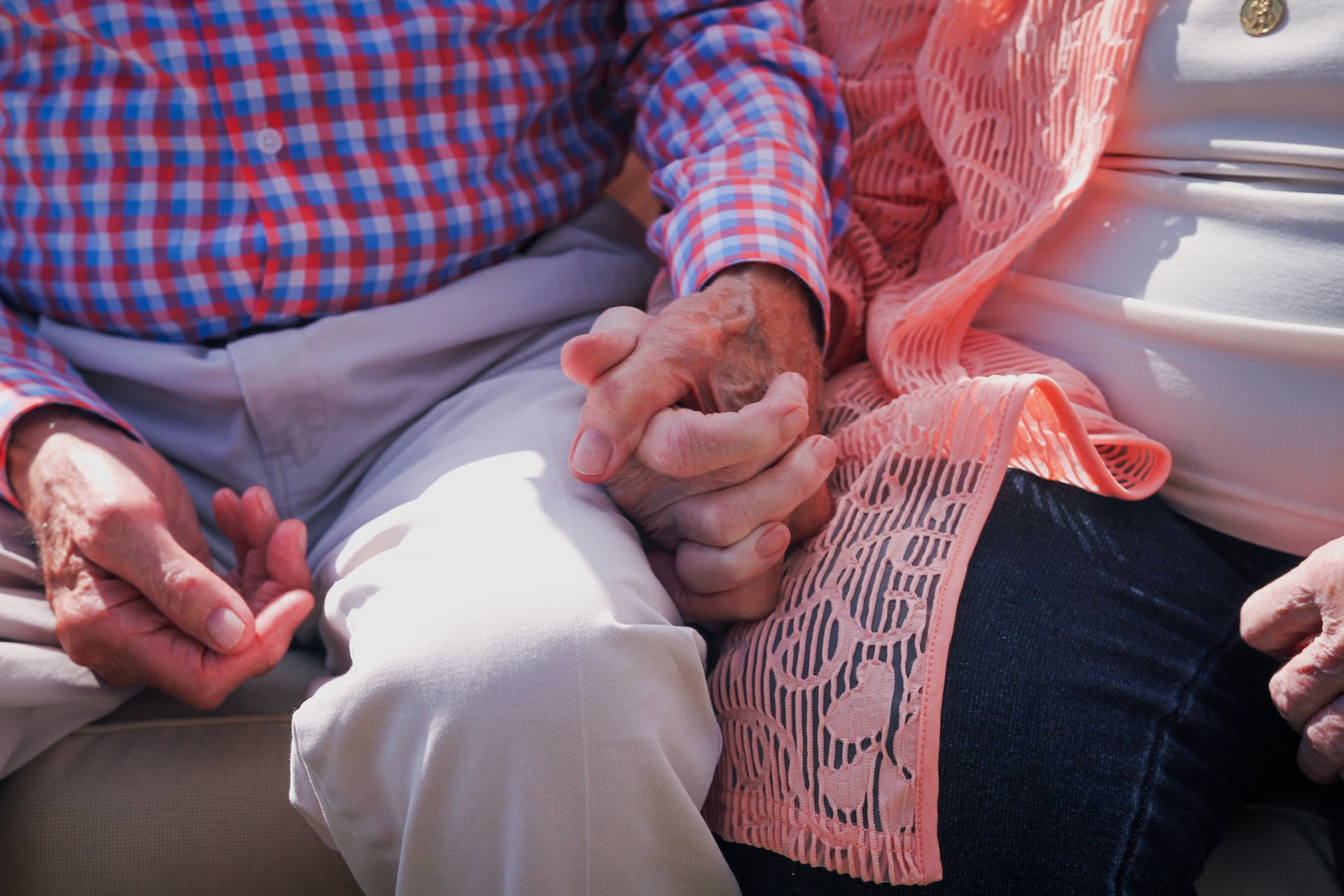 Photo of an elderly couple holding hands