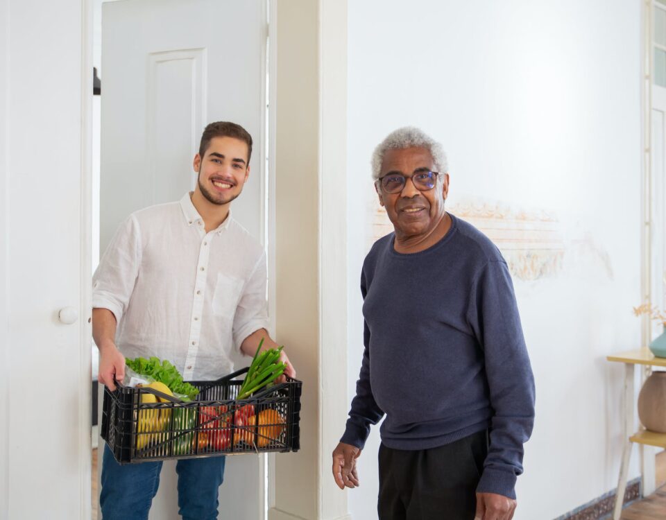 Photo of a caregiver delivering in-home groceries