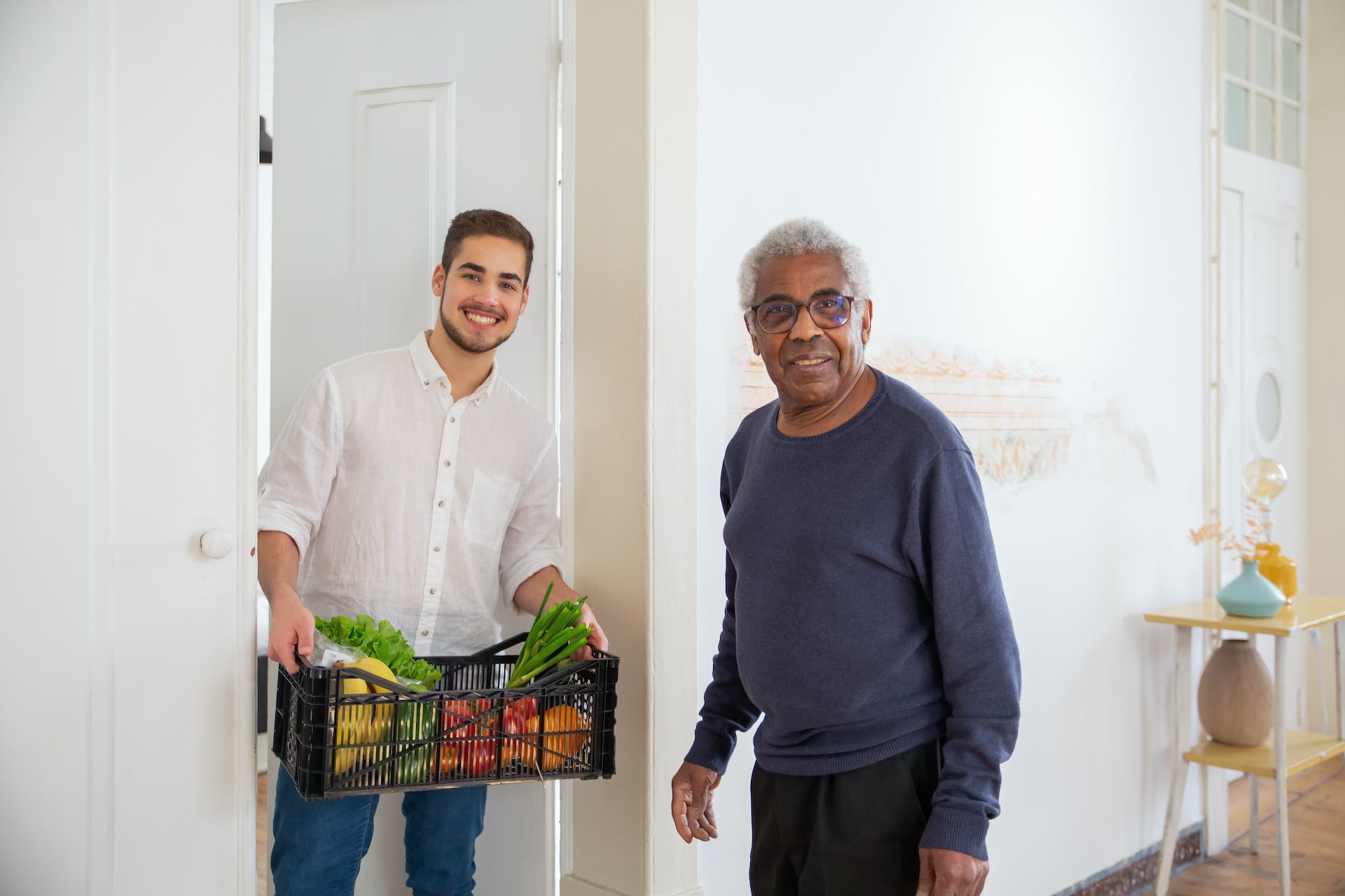 Photo of a caregiver delivering in-home groceries