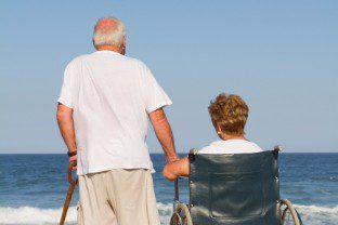 Elder couple spending time looking at the ocean