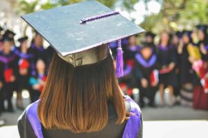 Back of woman’s head wearing graduation cap